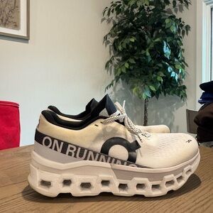 On Running White and Black Cloudmonster 2 athletic shoes